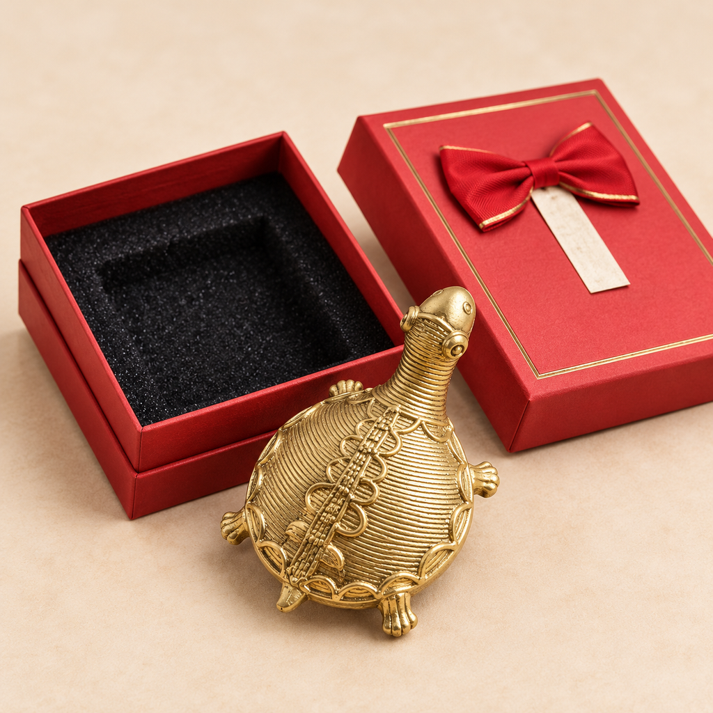 Dokra brass turtle figurine with red Diwali gift box and satin bow, by Kalavan